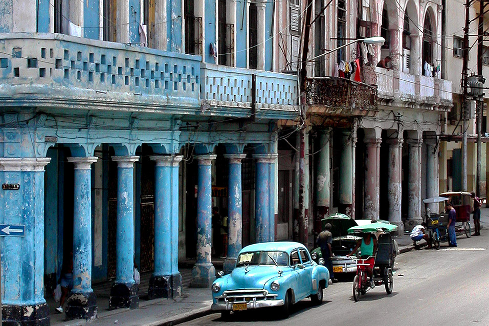 Old cars and bicitaxis Centro Habana Cuba May 21 2003